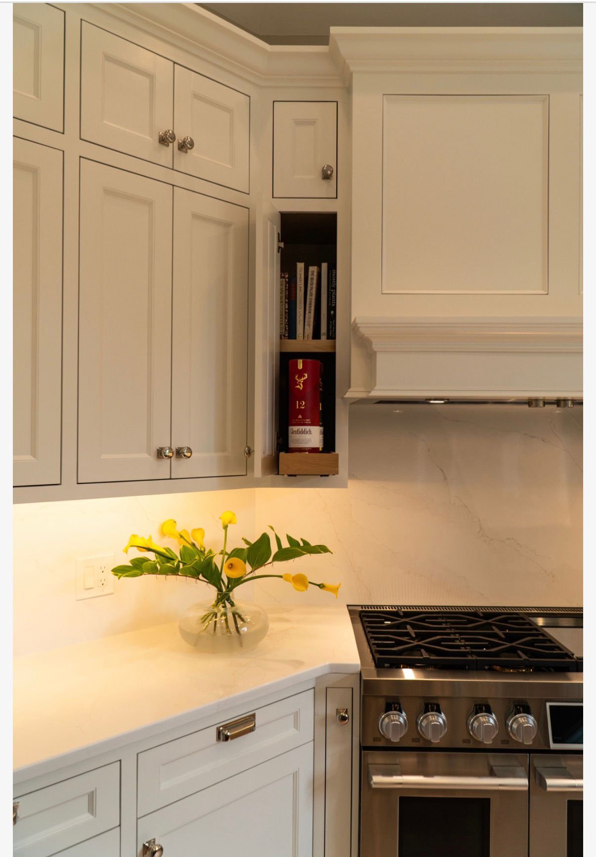Cabinetry corner beside the range with tulips
